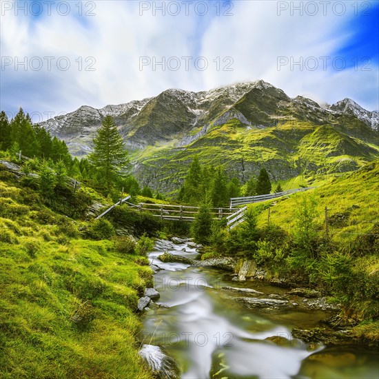 Stream flows through mountain landscape