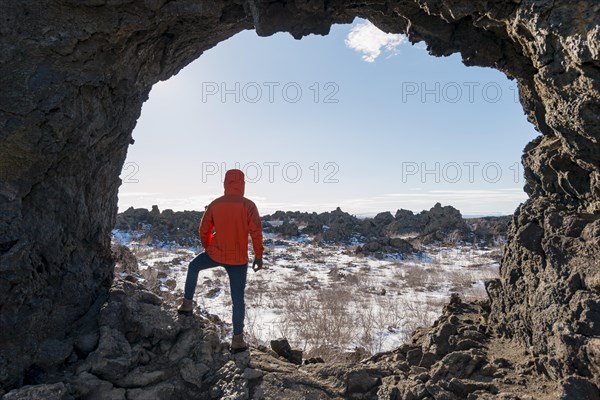 Man in a rock arch