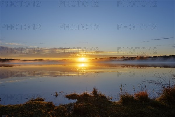 Sunrise with early morning mist over Kirchsee