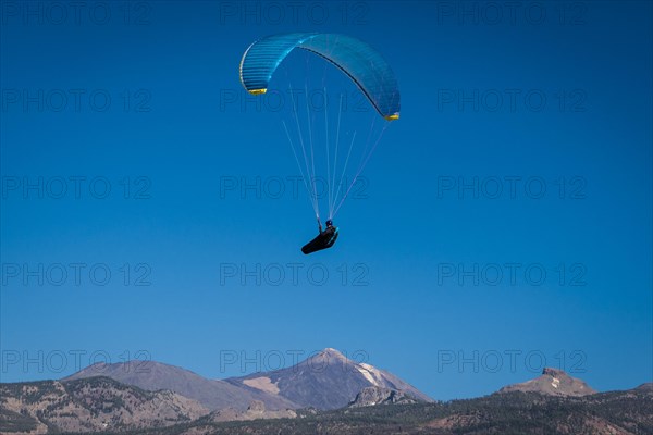 Paraglider over volcanic landscape in front of the Teide