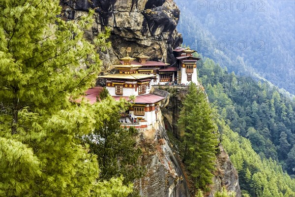 Buddhist tiger nest monastery Taktshang on steep rock face