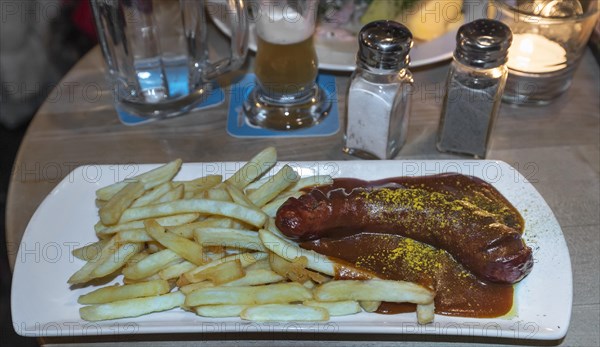 Currywurst with French fries