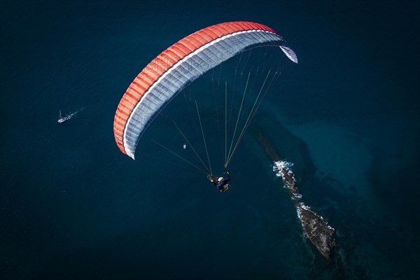 Paraglider over the Atlantic Ocean near La Caleta