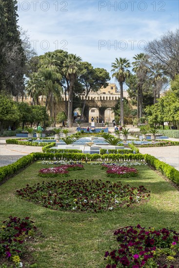 City park with fountain and flowers