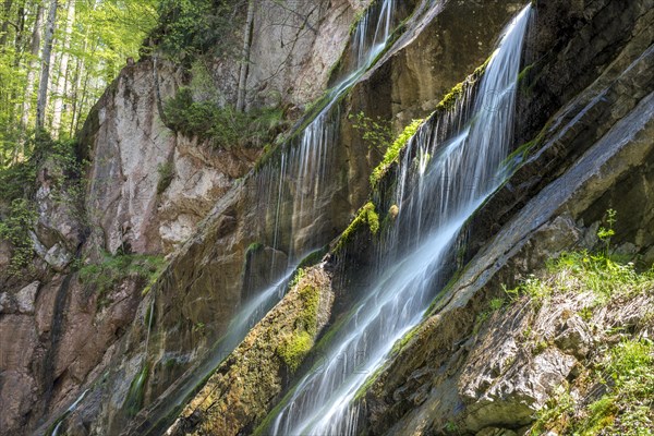 Waterfall on mossy slope