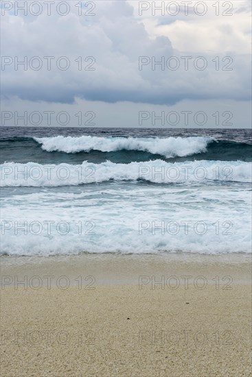 Storm and surf on the sandy beach