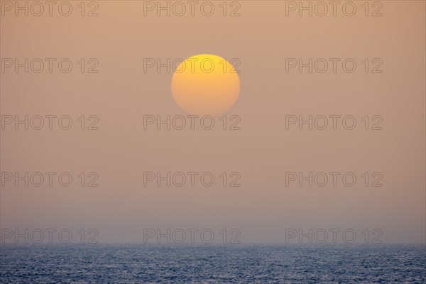 Sunset by sea fog