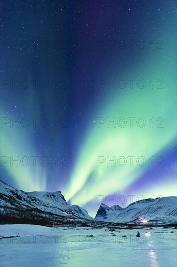 Northern Lights (Aurora borealis) over mountains