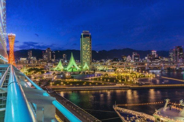 View of harbour with skyline at night