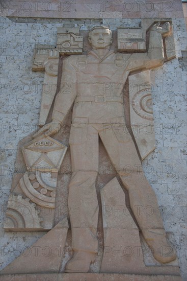 Socialist relief on old soviet factory building