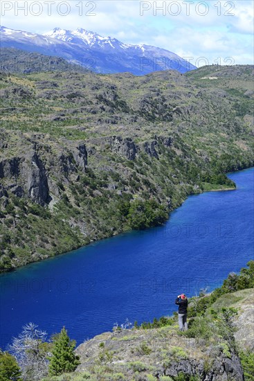 Tourist with binoculars at Lago Cochrane