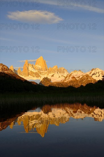 Mountain range with Cerro Fitz Roy at sunrise reflected in Lago de Los Tres