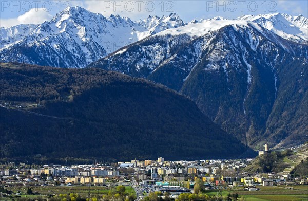 Place Martigny in front of snow-covered Valais Alps