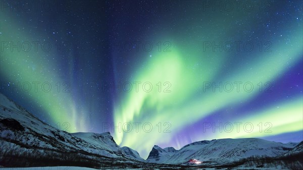 Northern Lights (Aurora borealis) over mountains