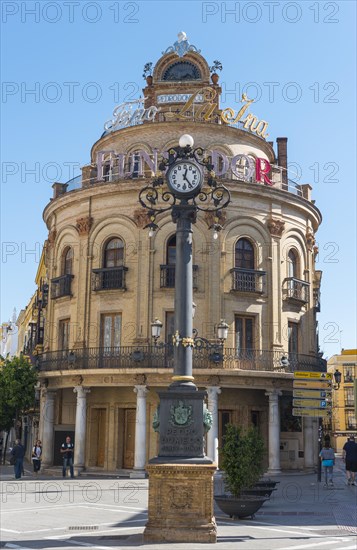 Round building El Gallo Azul with clock