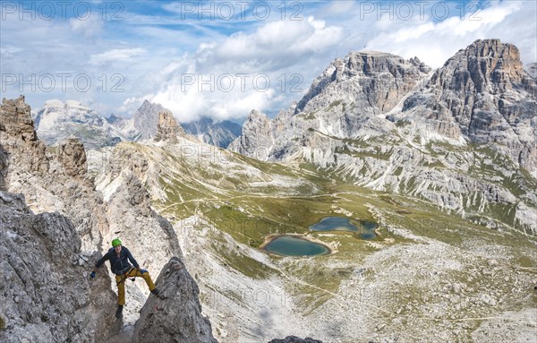 Hiker on the via ferrata to the Paternkofel