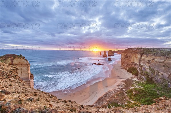 Rocky coast with the Twelve Apostles at sunset