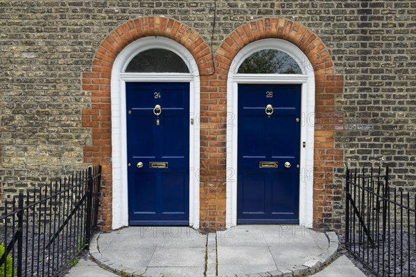 Blue front doors to townhouse