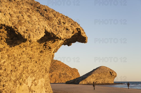 Fossilized lava tongues and walls at the beach Playa del Monsul