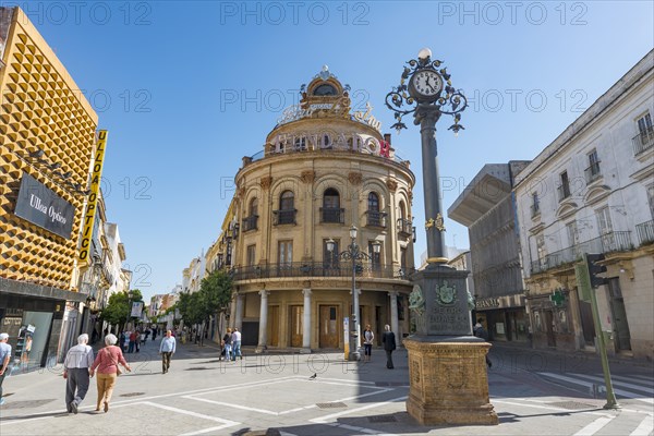 Round building El Gallo Azul with clock