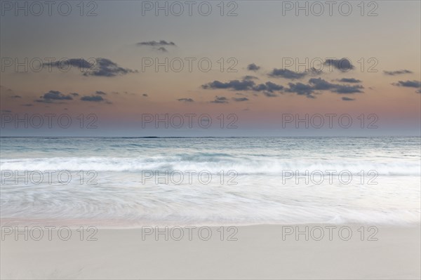 Surf during dusk over the sea