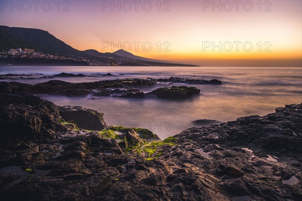 Rocky coast and sea at sunset