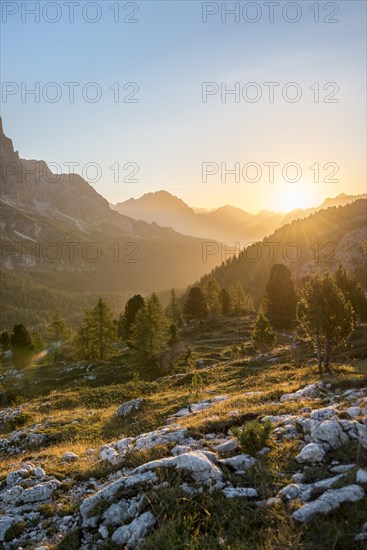 Sunrise in front of mountain silhouette