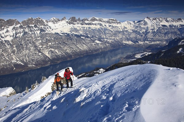 Two mountaineers on a ski tour in winter