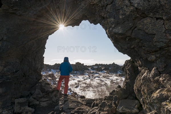 Man in a rock arch