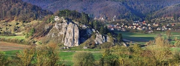 Rock group Burgsteinfelsen with the village of Breitenfurt in the Altmuhltal nature park Park