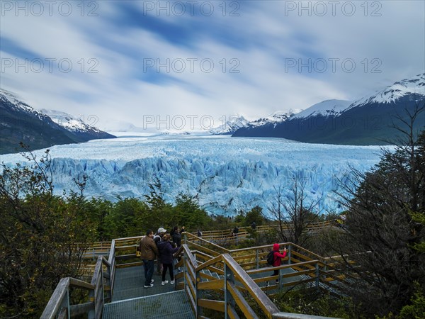 Tourists on a viewing platform at the Perito Moreno glacier