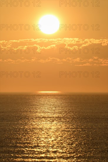 Sunset with cloud band over the North Sea