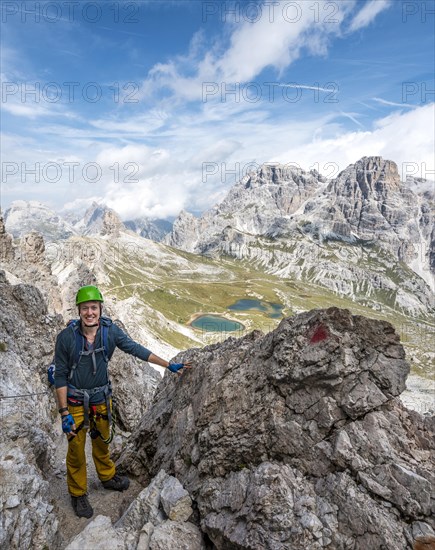 Hiker on the via ferrata to the Paternkofel