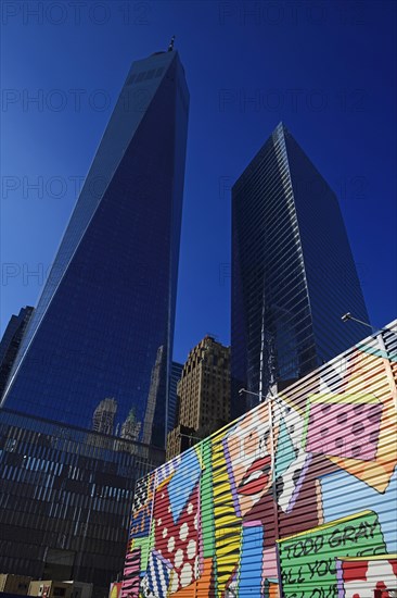 Building site with graffiti decorated walls in front of One World Trade Center Transportation Hub