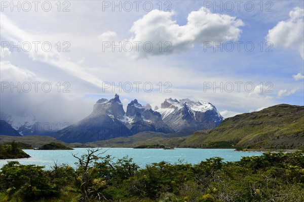 Cuernos del Paine massif with clouds on Lake Pehoe