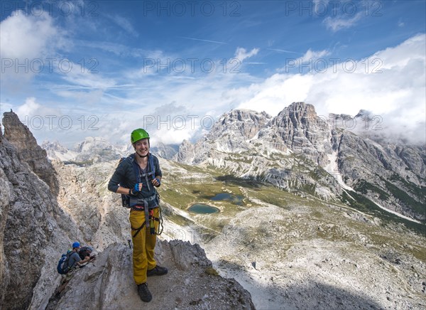 Hiker on the via ferrata to the Paternkofel