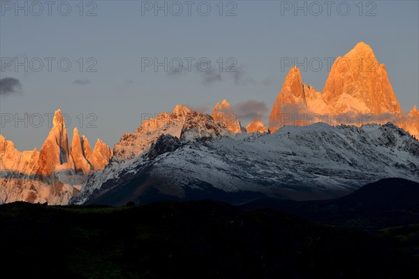 Snow-covered mountain range of the Fitz Roy and Cerro Torre at sunrise