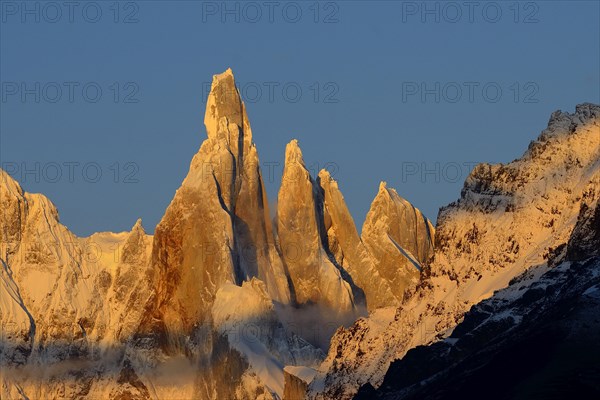 Cerro Torre with snow at sunrise