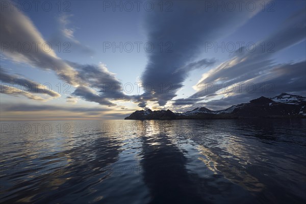 Sunrise at Stromness with cloud formations and reflections in the bay