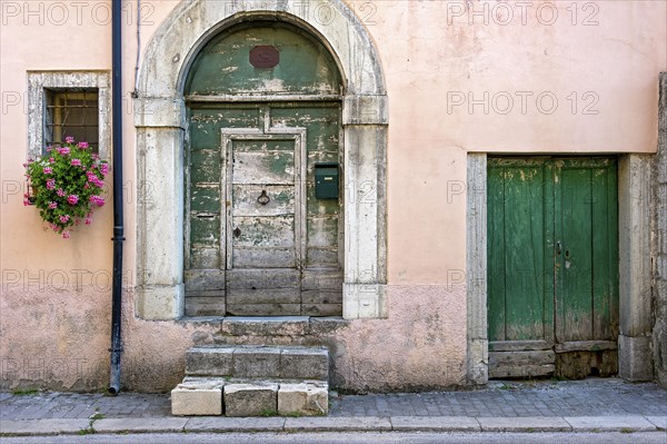 Facade with old weathered front door