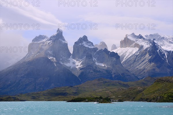 Cuernos del Paine massif with clouds on Lake Pehoe