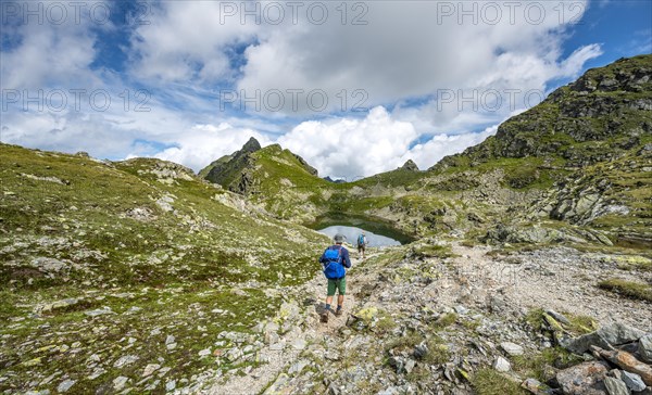 Hikers at small lakes in the Klafferkessel