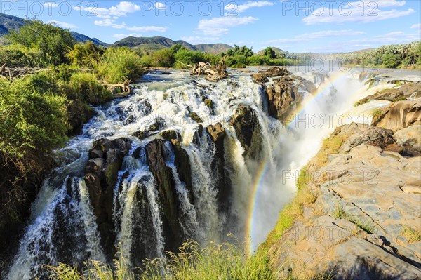 Rainbow over waterfall