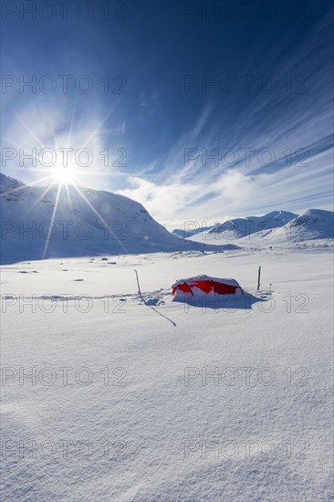 Tent with sun in the snow