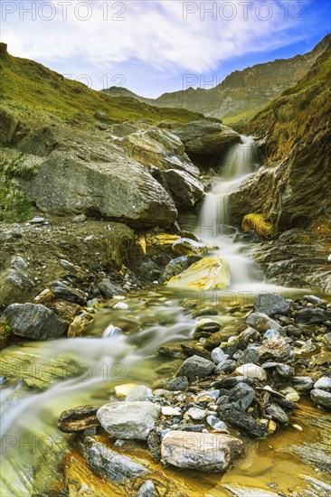 Mountain landscape with small waterfall