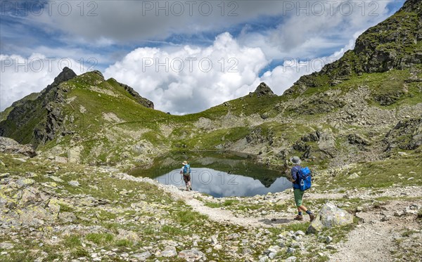 Hikers at small lakes in the Klafferkessel