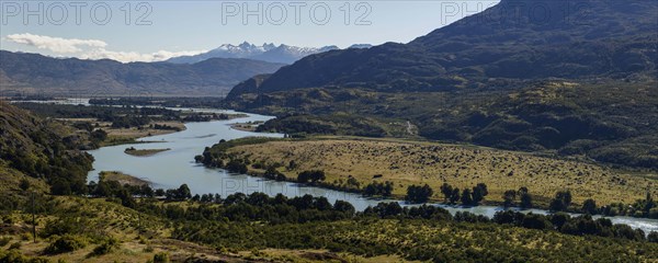 Rio Baker glacier river with the mountains of the Andes