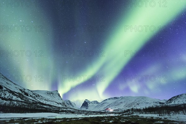 Northern Lights (Aurora borealis) over mountains