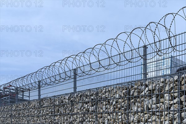 Barbed wire secured stone wall