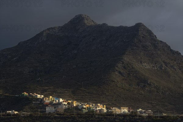 Colorful houses of Punta Hidalgo in front of Anaga Mountains